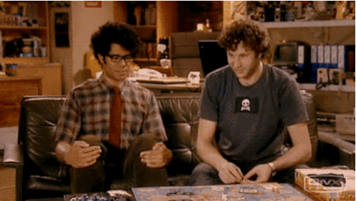 Gif from the IT Crowd of two people giving each other a high five